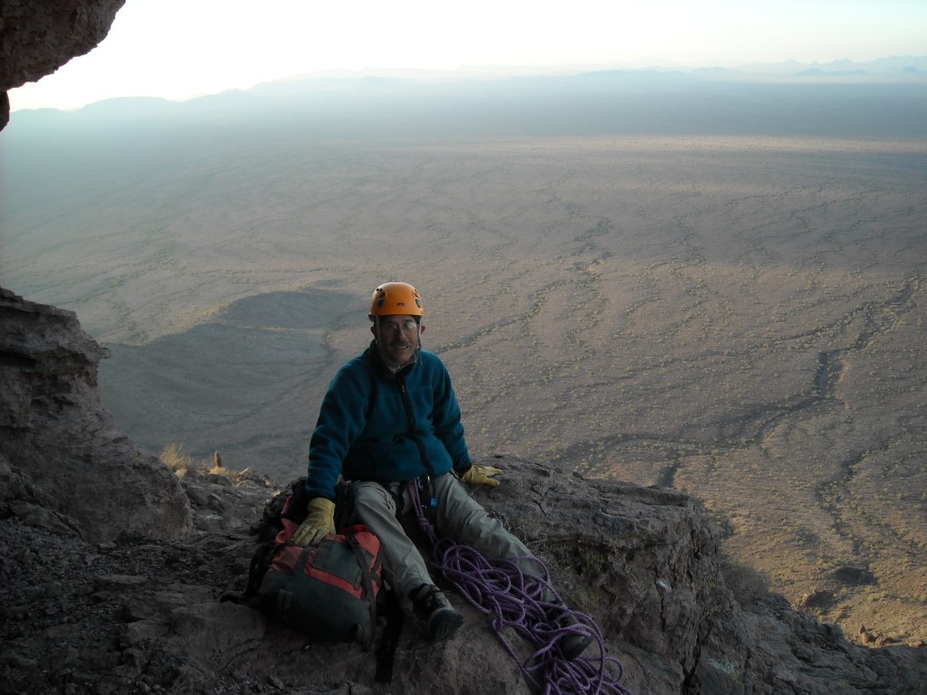 Taking a break at the belay station at the start of the fourth pitch