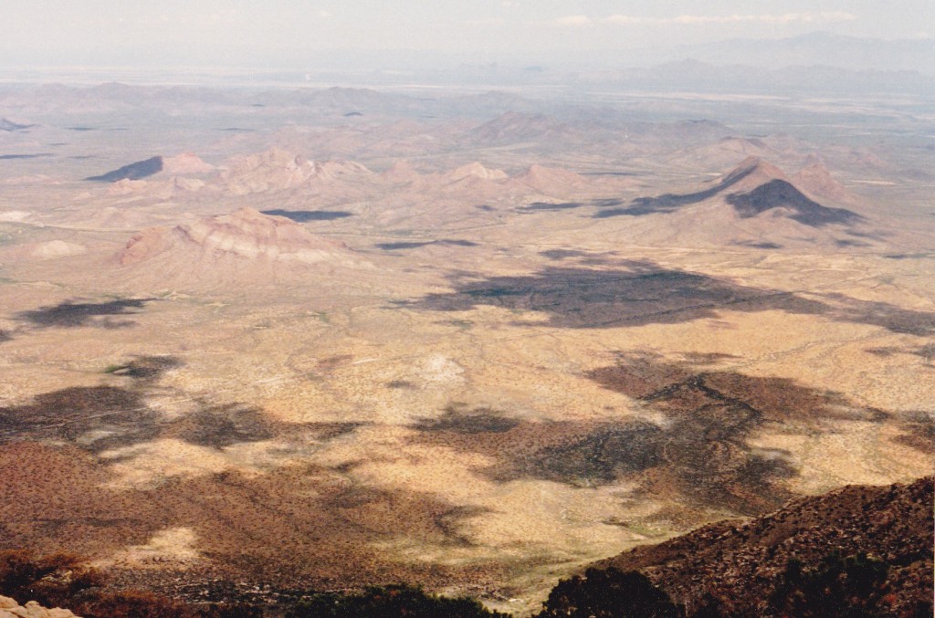 Bell Mountain (left center with light band); Martina Mountain on upper right with dark shadow