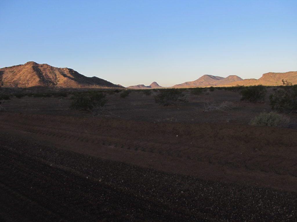 Along the road with the deep gravel. 3 of our peaks in the distance.