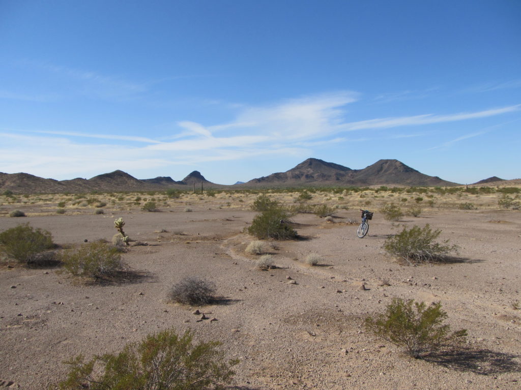 This is where we parked our bikes, out in the open. Our first 2 peaks are in the middle of the photo.