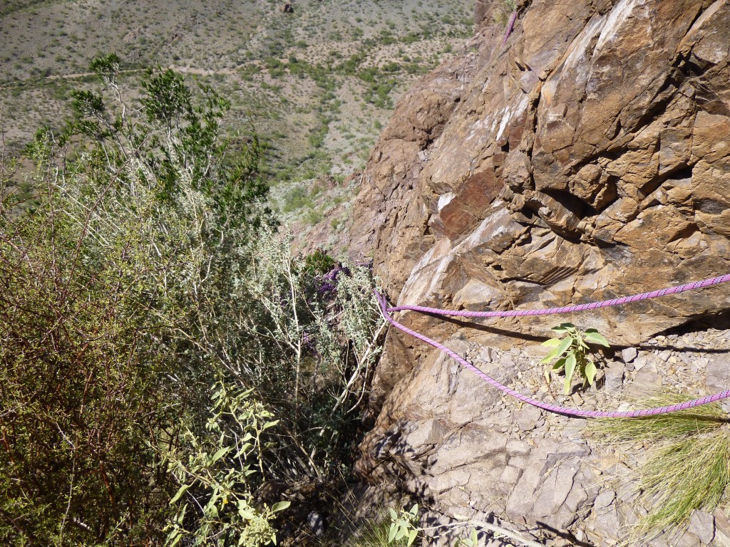 The rope hanging down the south face of Ajo Peak