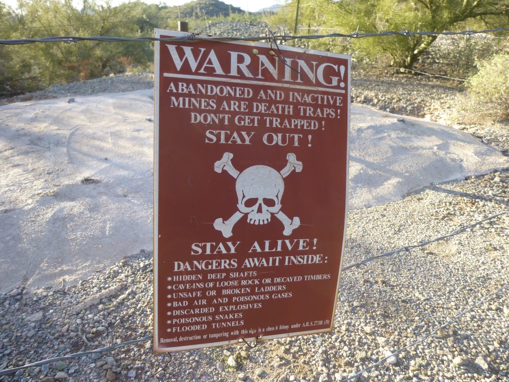 The warning sign by the mine shaft