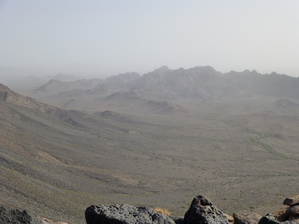 Clouds of dust filling the air to the south over the Aguilas